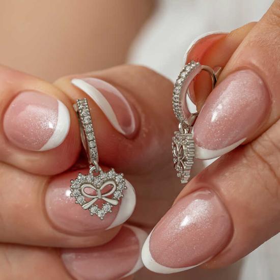 Gümüş Kalp Kurdele Sallantılı Kadın Küpe Gümüş Kalp Kurdele Sallantılı Kadın Küpe